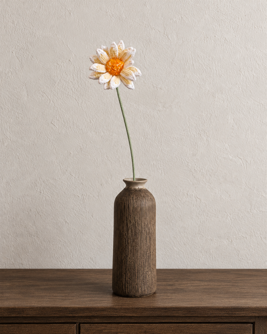 Cream white crochet cosmos in a walnut-brown textured vase; vase not included