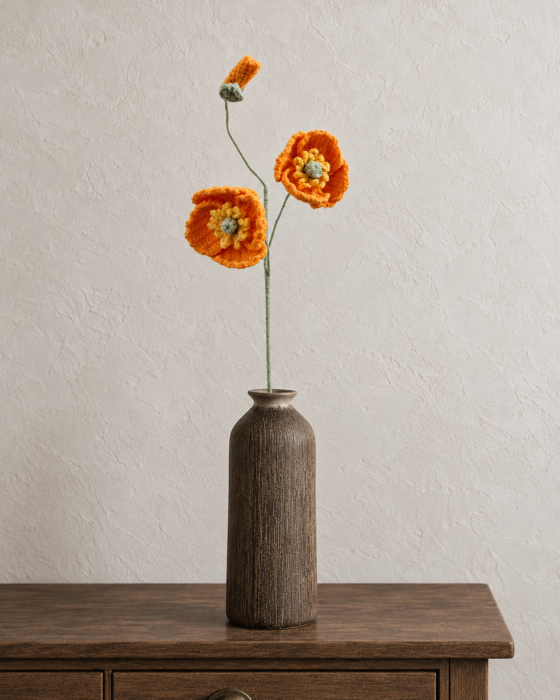 Golden orange crochet poppy stem with two flowers and a bud; vase not included